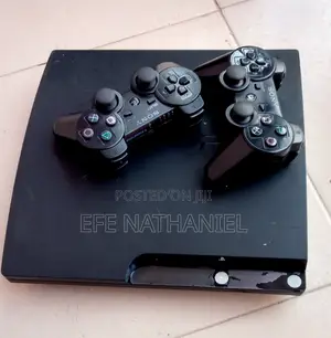 Photo - Playstation 3 Slim Loaded With Games