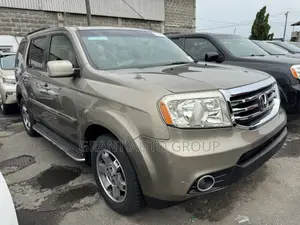 Honda Pilot Touring w/RES/Navi 4WD (3.5L 6cyl 5A) 2011 Gold
