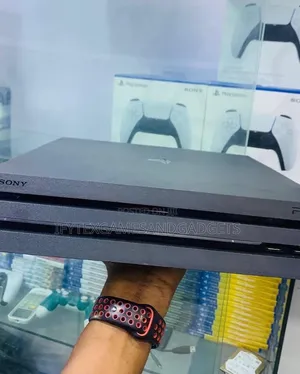 Clean London Used Ps 4 Pro With 2 Pads and 12 Digital Games