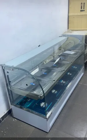 A Foreign Curved Glass Food Warmer Bain Marie Machine