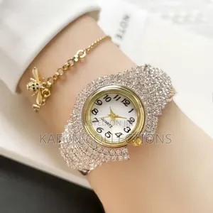 Photo - Gold Bangle Bracelet Watch