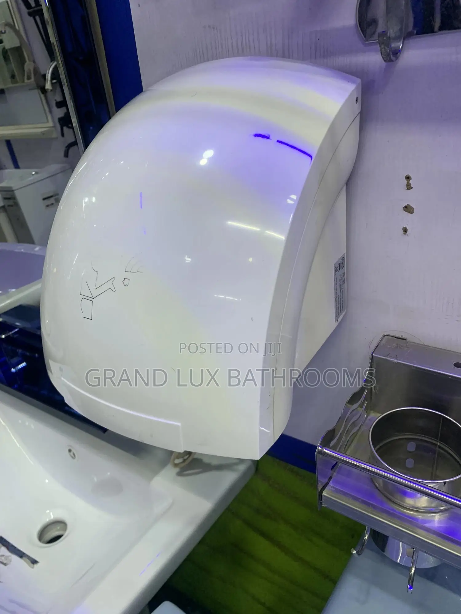 Wall-mounted Automatic Hand Dryer In Modern Bathroom