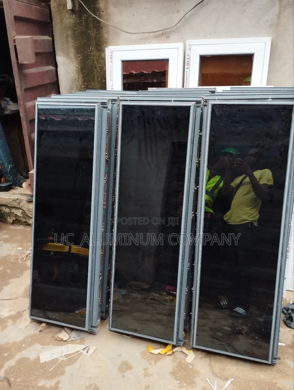 White Frameless Window With Grey Reflective Glass