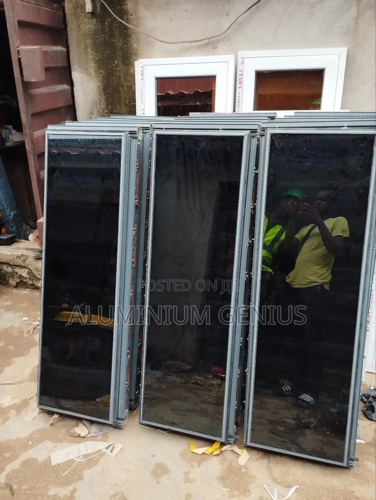White Frameless Window With Grey Reflective Glass