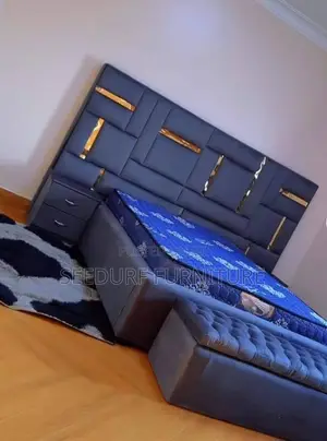 A Quality Made Bed Frame Attached With Ottoman