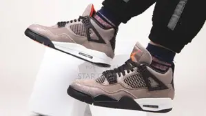Photo - Silent Statement: Own the Air Jordan 4 'Taupe