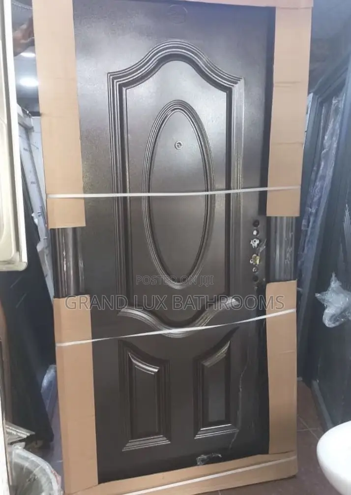 Embossed Steel Security Door With Central Oval Panel Design