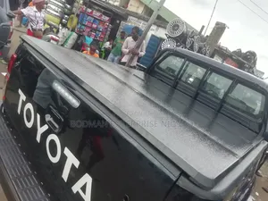 Hard Folding Cover for Toyota Hilux - _×\÷