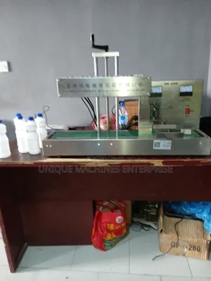 Automatic Induction Foil Sealing. Induction Foil Sealing Machine