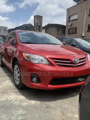 Photo - Toyota Corolla LE 4dr Sedan (1.8L 4cyl 4A) 2013 Red