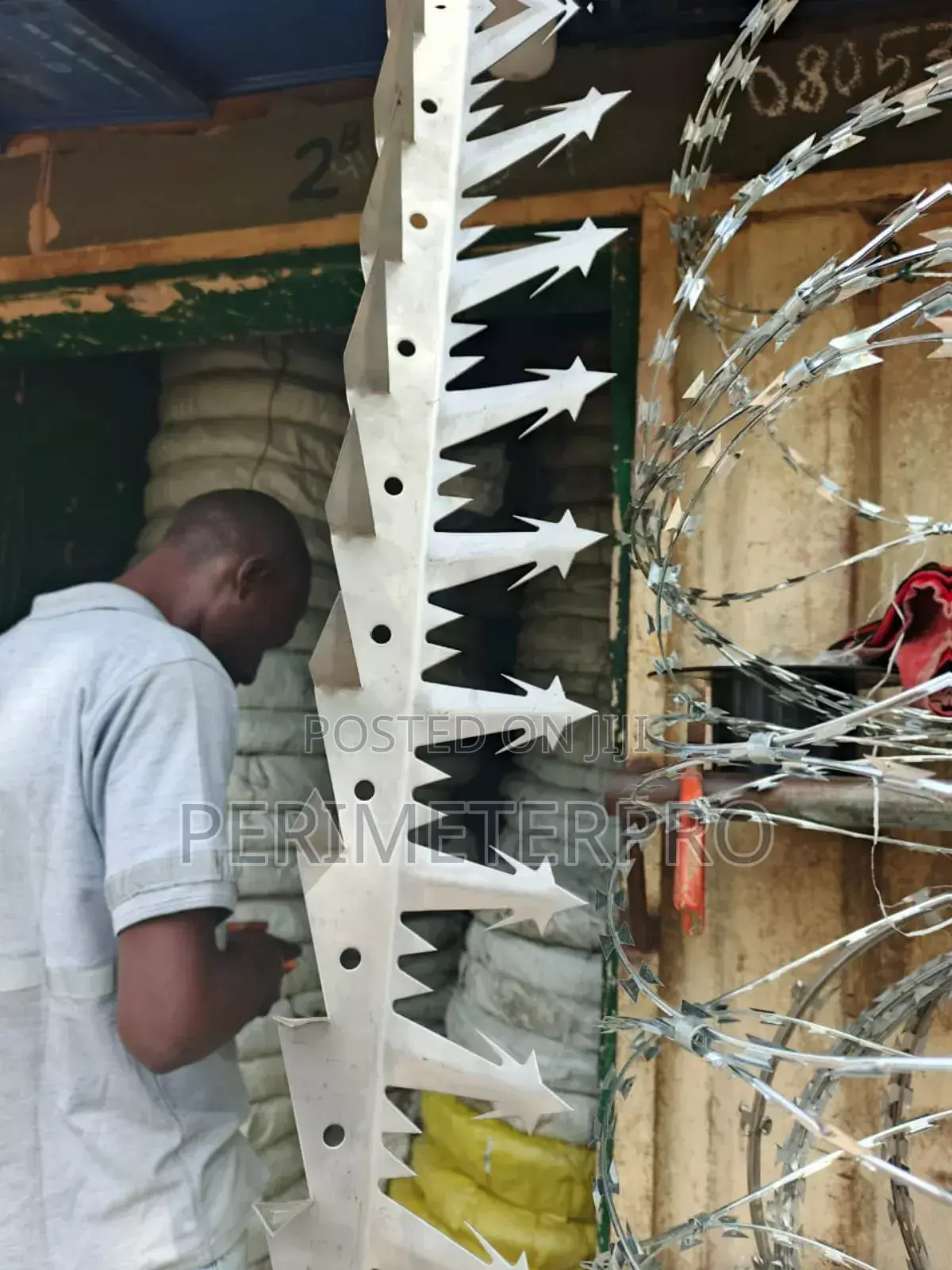 Spikes Installation On Fence