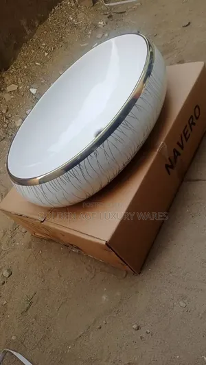 Silver and White Egg Shaped Basin