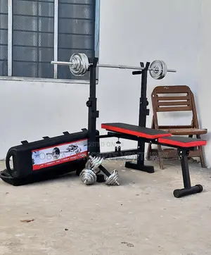 Photo - Adjustable Weight Lifting Bench With Bars And Weight