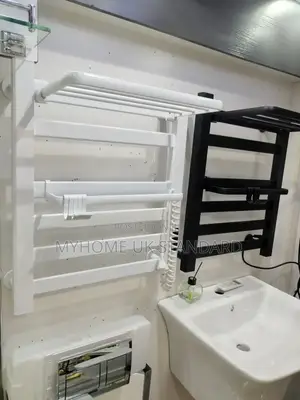 Wall-Mounted Heated Towel Rack With a Top Shelf