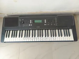 Photo - Neatly Used Yamaha Keyboard Piano PSR-E373 With Powe Adapter