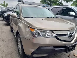 Photo - Acura MDX Technology Package AWD (3.7 6cyl 5A) 2008 Gold