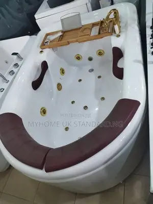 Luxury Jacuzzi Bathtub With Golden Accessories.