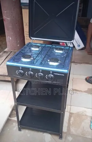 4-Burner Gas Cooker With a Stand That Includes Two Shelves.