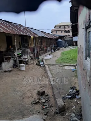 Land Facing a Busy Food Markert at Ijegun