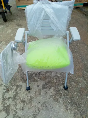 Executive Folding and Moveable Chair With Writing Pard.