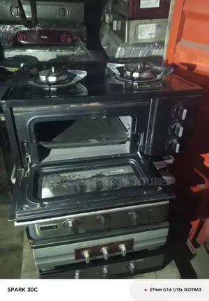 Table-Top Gas Cooker With an Integrated Oven and Grill.