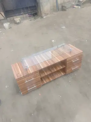 4ft Tv Stand. Brown Color With Glass Top