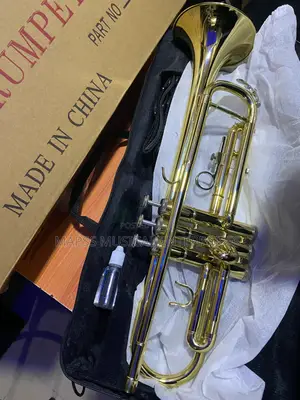 Gold-Colored Yamaha Trumpet With Accessories