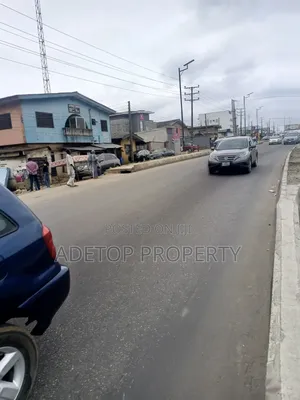 A Plot of Land Facing Lagos Road With Ten Shops