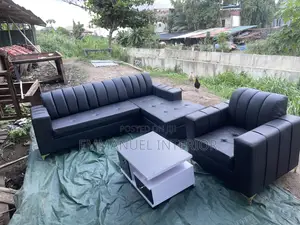 A Standard Leather Sofa With Center Table