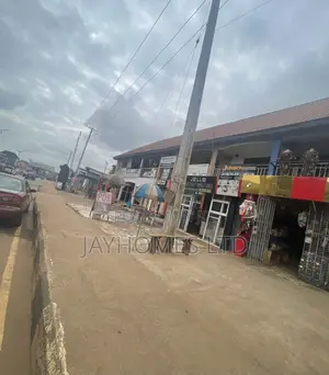 Plaza With 13 Shops on a 100by70 for Sale in Okpanam Road Asaba