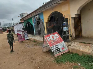 Full Plots Ayobo With 4 Lockup Shops in Fron