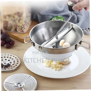 Stainless Steel Potato Ricer, Also Known as a Food Mill or Masher,
