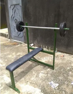 Weight Bench With a Barbell and Weights