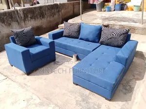 Blue Color L Shape Sofas and a Single Seater