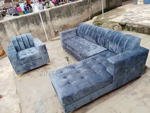 Well Furnished Gray L-Shaped Sofa and a Single Seater