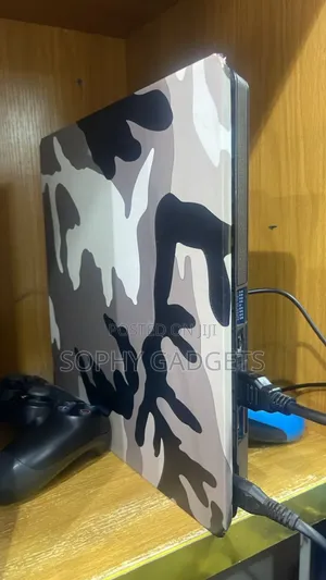Uk Used Ps 4 Slim Lim With 2 Controllers and Games