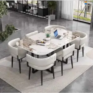 Marble-Finish Rectangular Dining Table Set With Padded Chairs.