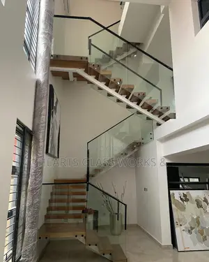 Floating Stair Rail Installation With Side Mount Glass