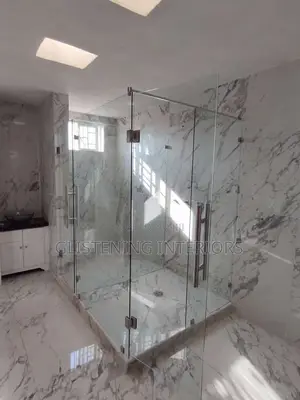 Shower Cubicle Hung Design With A Silver Accessories,