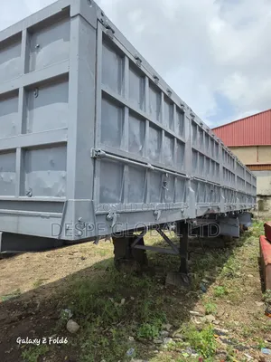 A 3 Axle Refurbished Big Sided Body Trailer That Can Tip Sideways