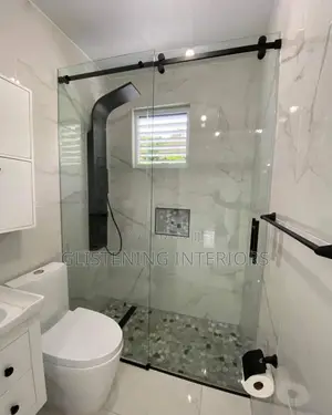 Sliding Shower Cubicles With A Black Accessories