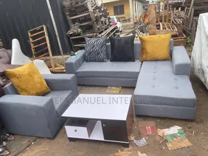 A 7 Seater Grey Sofa With Center Table