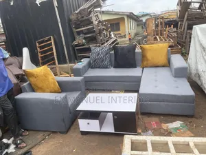 A 7 Seater Grey Sofa With Center Table