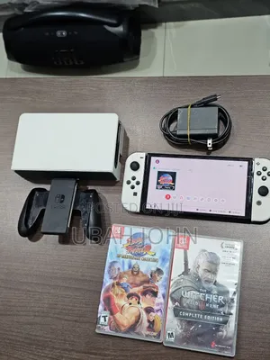 Clean Nintendo Switch Oled With 2 Games