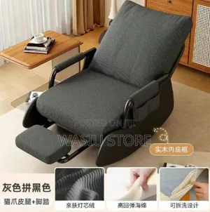 Modern Style Rocking Armchair With a Footrest and Side Pockets