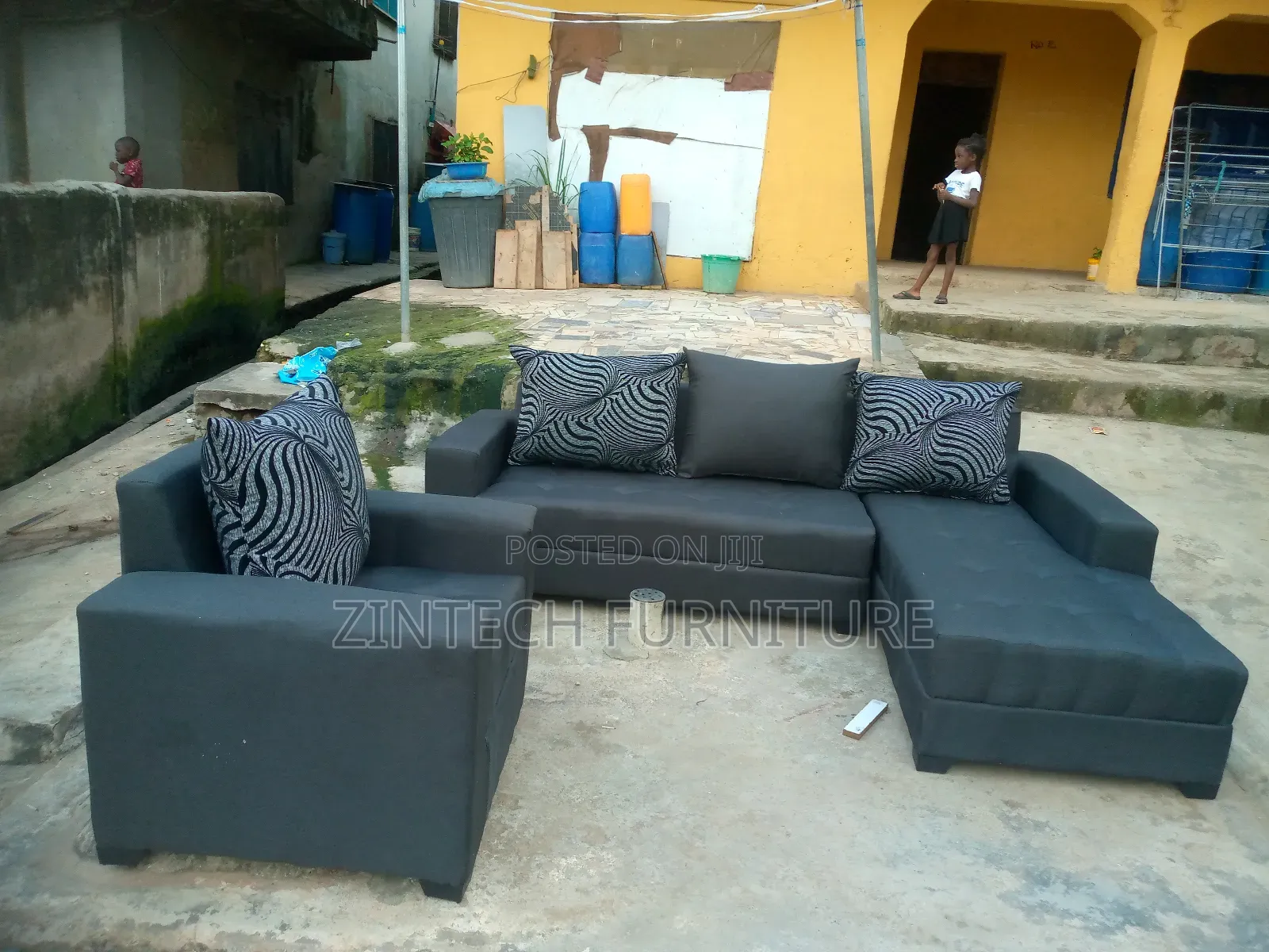 Dark Gray L Shape Sofas and a Single Sit