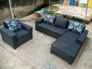 Dark Grey L Shape Couch and a Single Seater