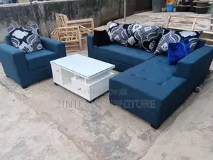 L Shape Sofas and a White Center Table