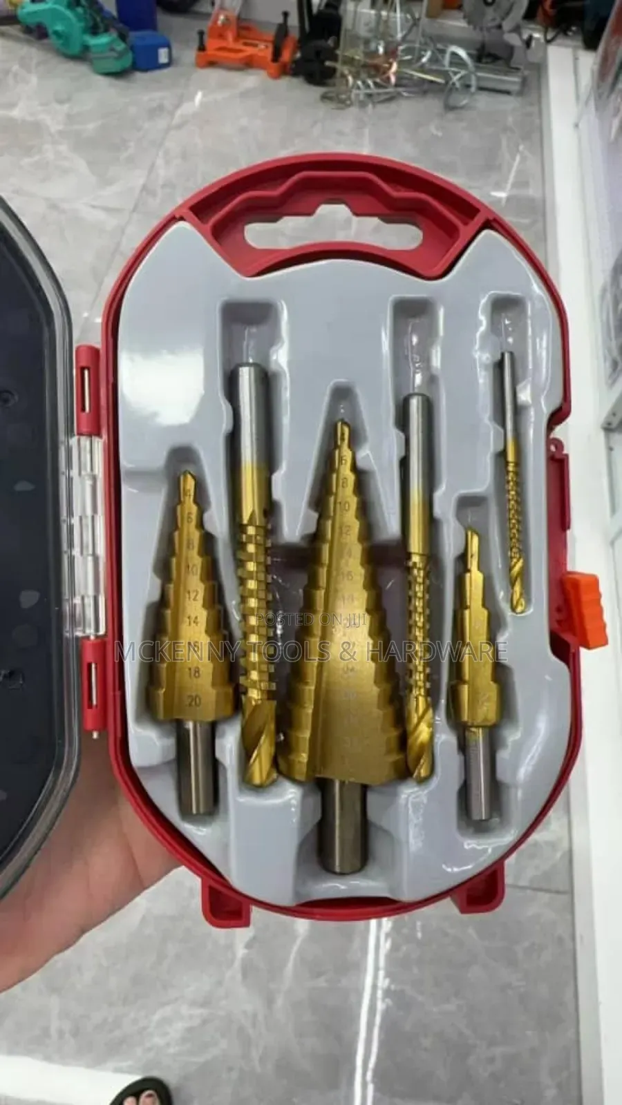 Set Of Step Drill Bits In A Red Case. Step Drill Bits Are
