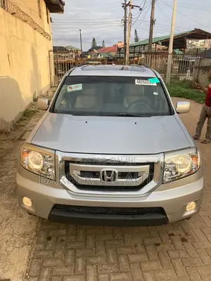 Honda Pilot Touring w/RES/Navi FWD (3.5L 6cyl 5A) 2010 Silver